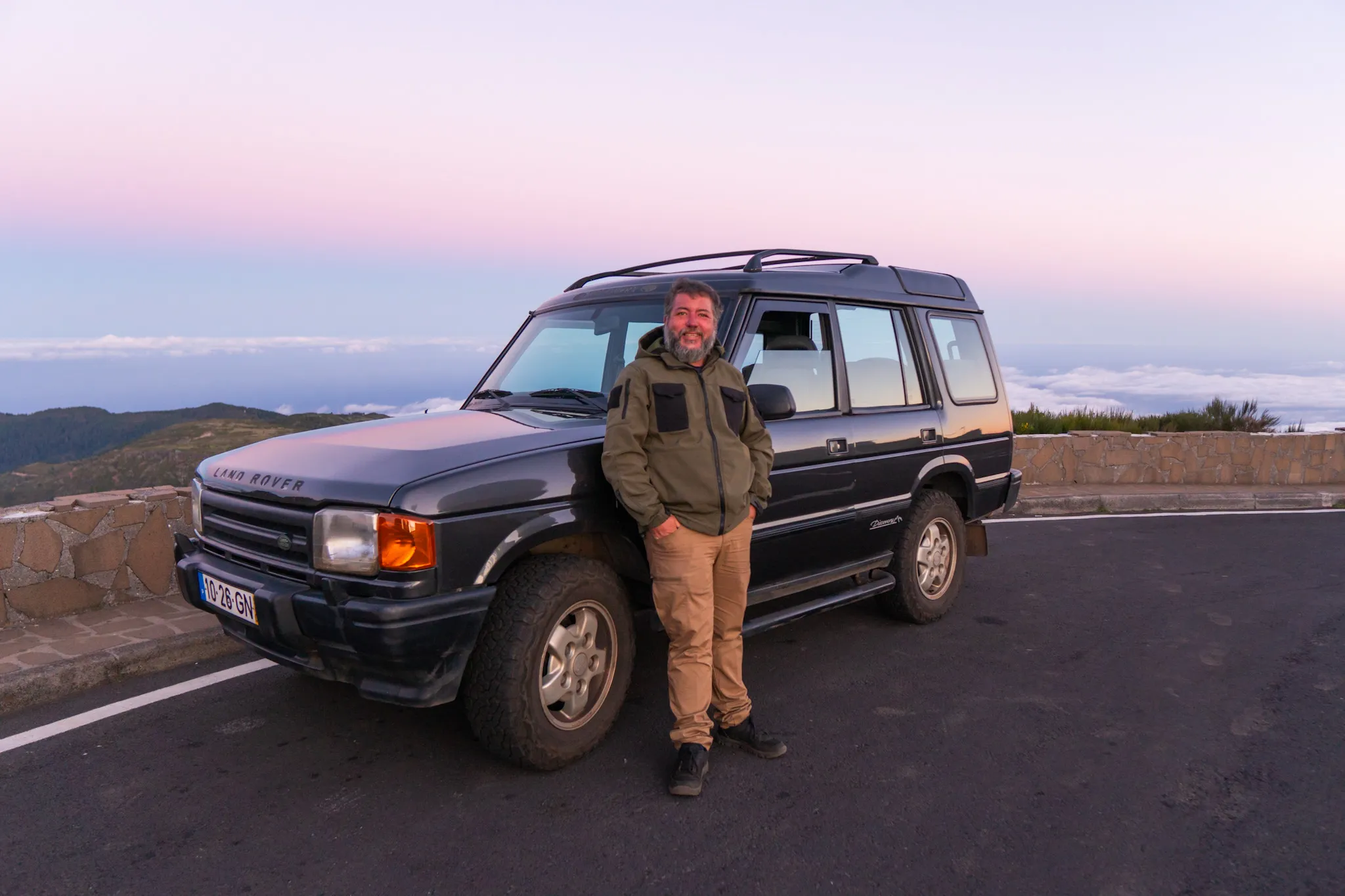 Jeep at a viewpoint, sun low